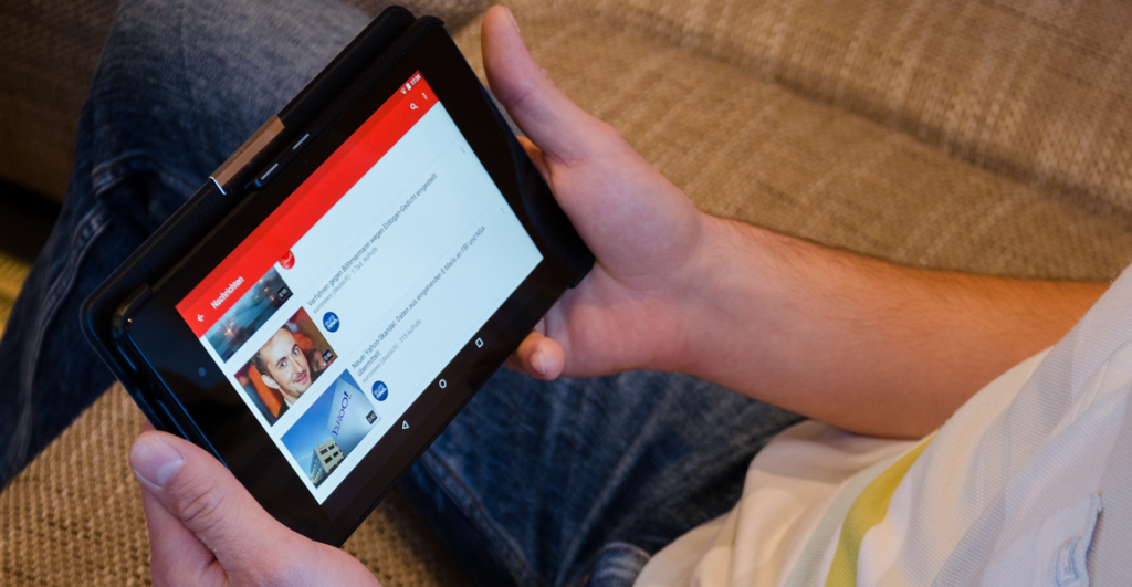 Man watch Tablet Youtube